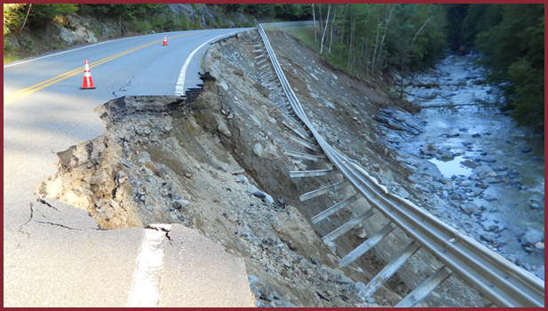 road washout by storm and river